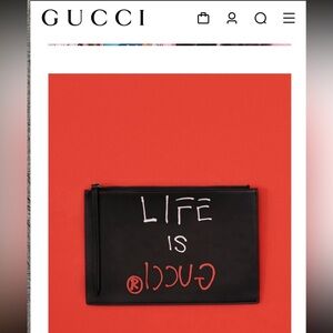 “Life is Gucci” leather Gucci Clutch